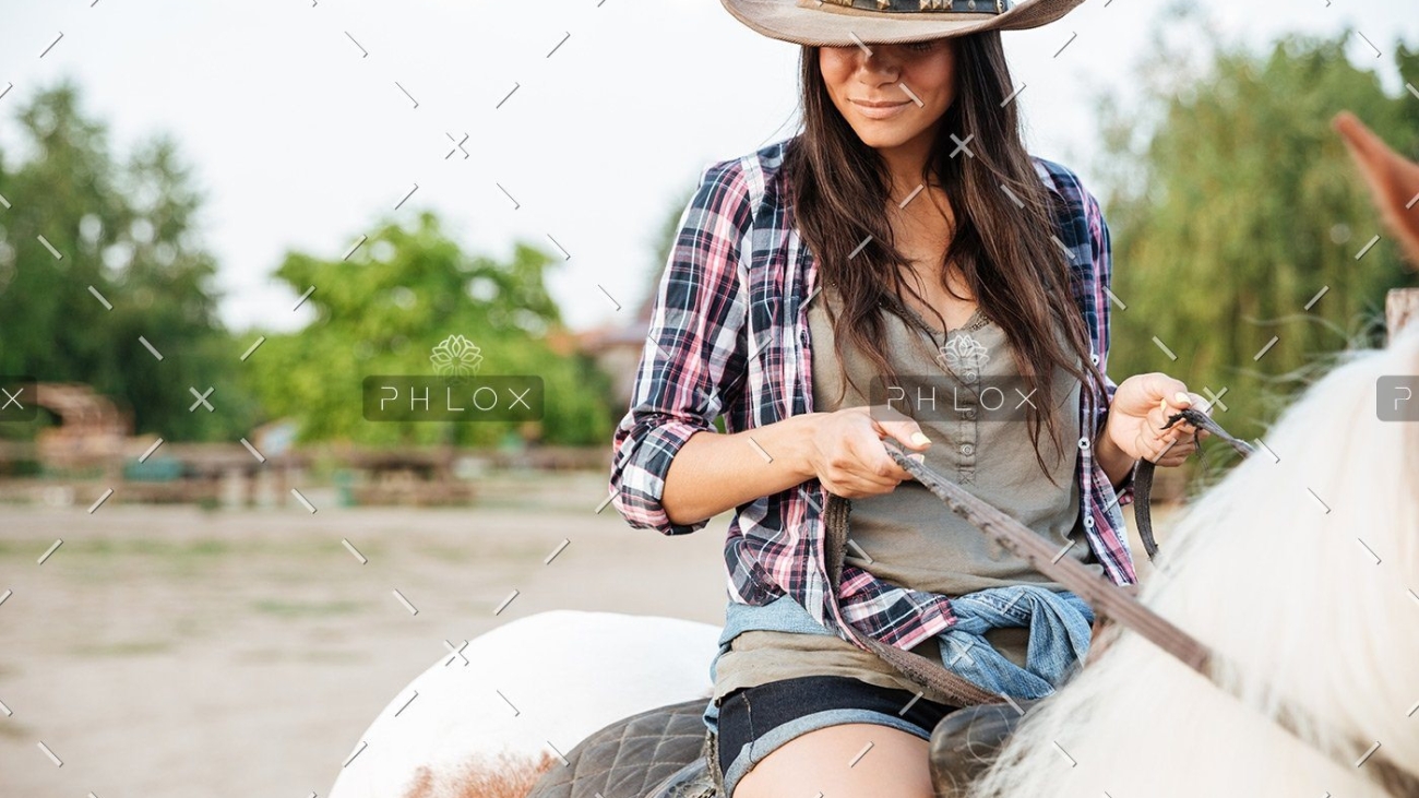 demo-attachment-19-beautiful-young-woman-cowgirl-sitting-and-riding-P3DWVG6