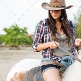 demo-attachment-19-beautiful-young-woman-cowgirl-sitting-and-riding-P3DWVG6
